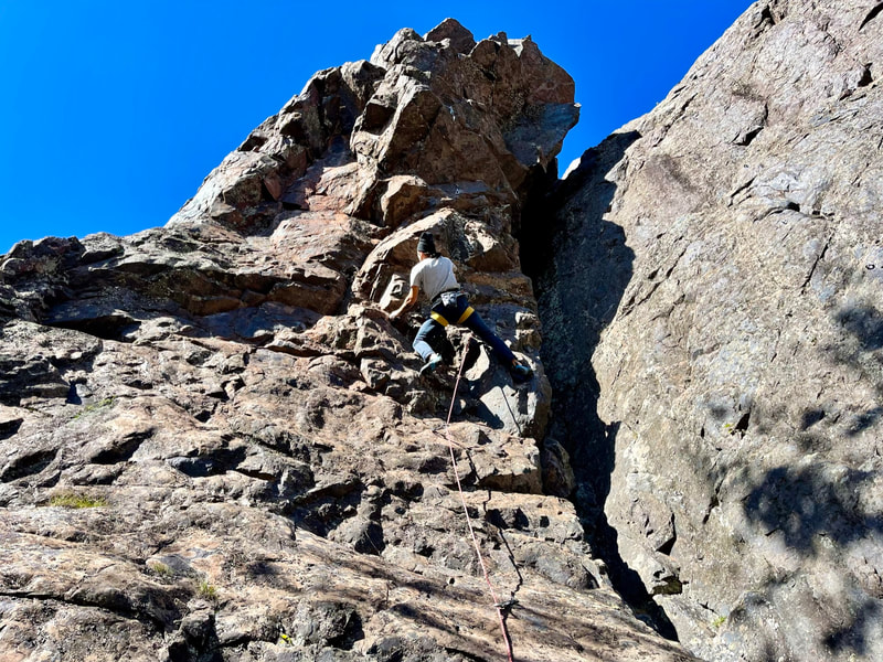Photo of Sam Elias climbing Four Star Arete